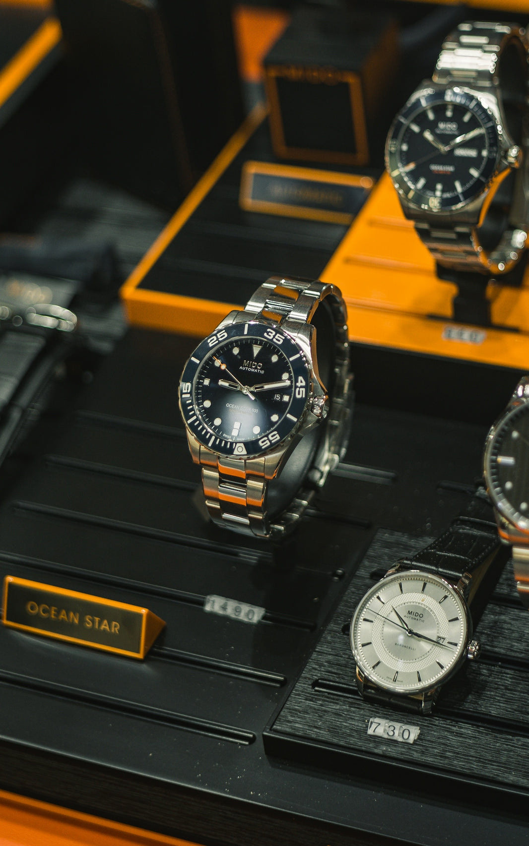 a group of watches on a display
