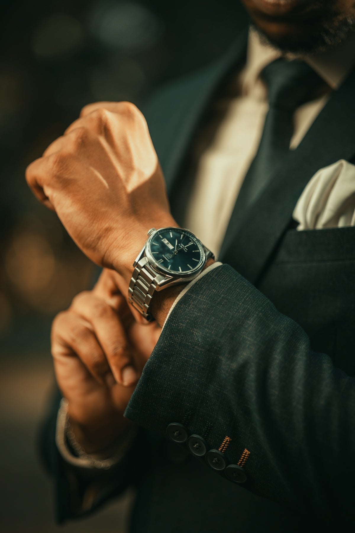 a close up of a person wearing a watch